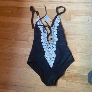 NWT Kona Sol black/lace one piece swimsuit. Size small.